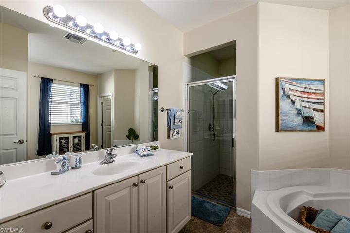 Bathroom 3 of 3 is the primary bath with walk in shower and soaking tub