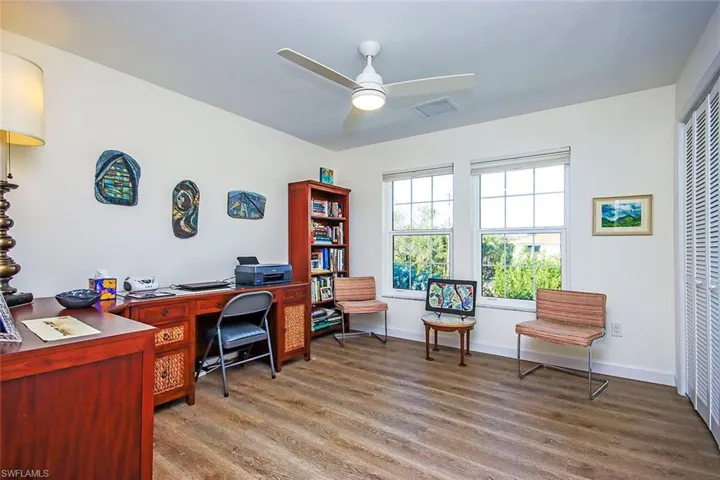 Home office/ 3rd bedrom with ceiling fan and hardwood / wood-style floors