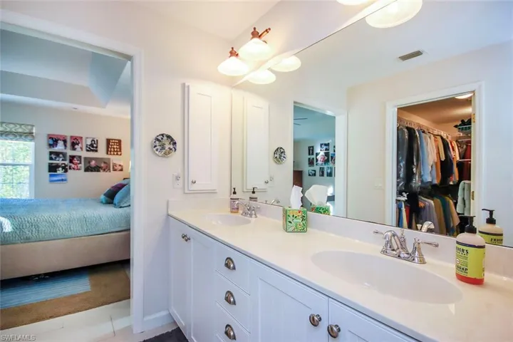 Bathroom featuring tile patterned floors and vanity
