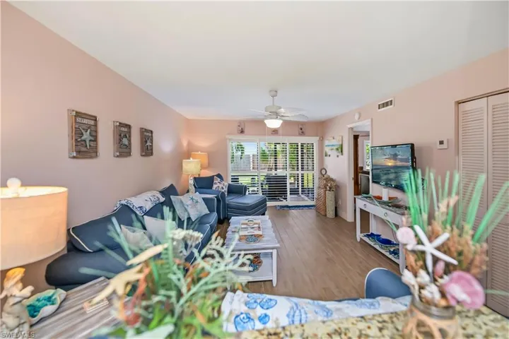 Open-concept living area featuring light wood-finish flooring