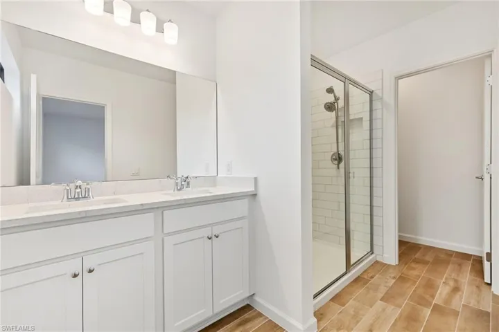 Dual vanity with undermount sinks and light-toned countertops