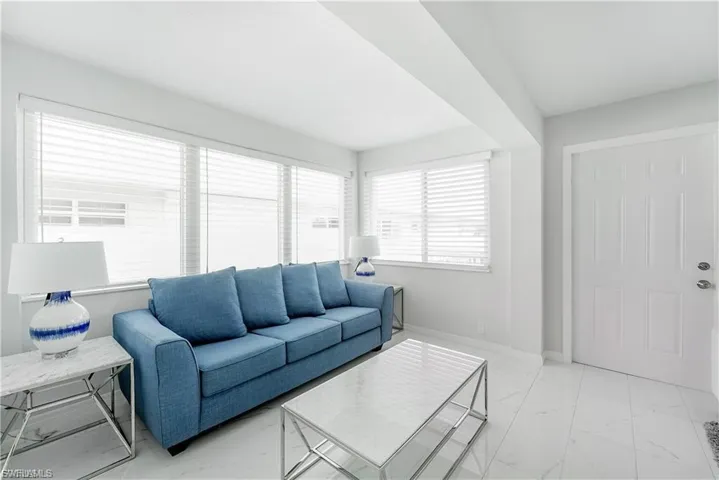 Living room with light marble finish floors
