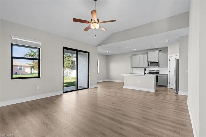 Entrance foyer with baseboards and wood tiled floors