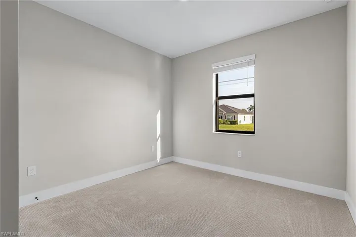 Washroom with wood finish floors, electric dryer hookup, and washer hookup