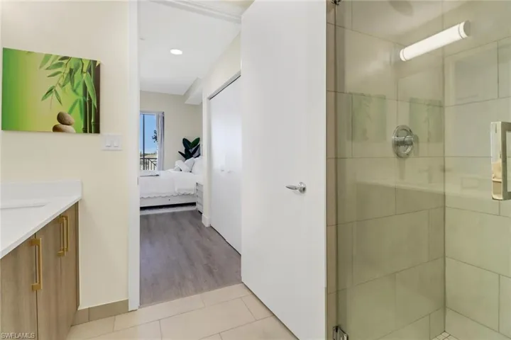 Spa Style bathroom with freestanding frameless glass shower.