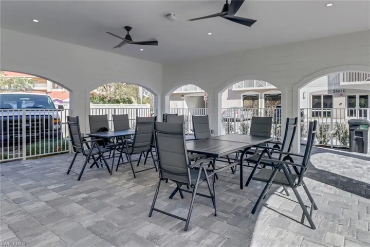 Have lunch with friends and family off the pool in covered dining patio.