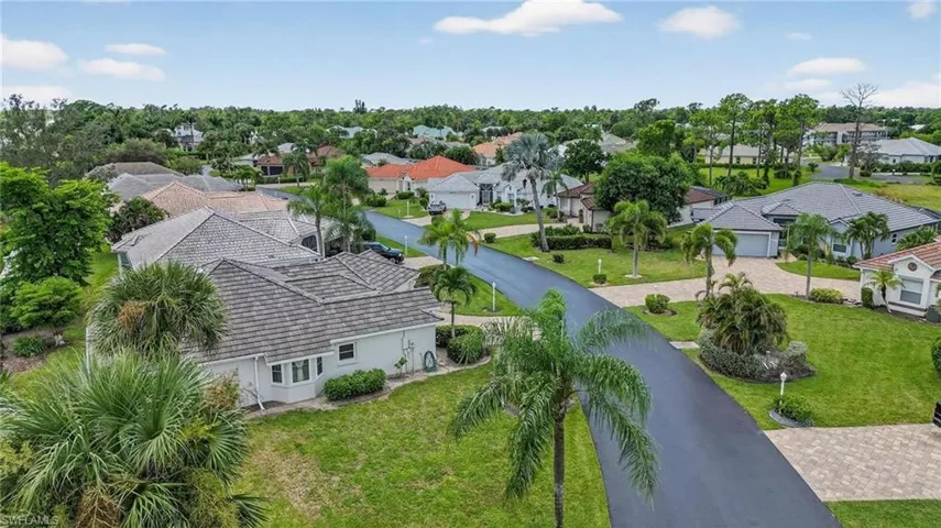 Residential neighborhood featuring paved streets and mature landscaping