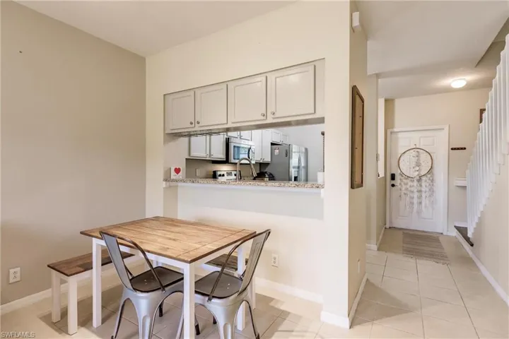 Dining room with light tile flooring