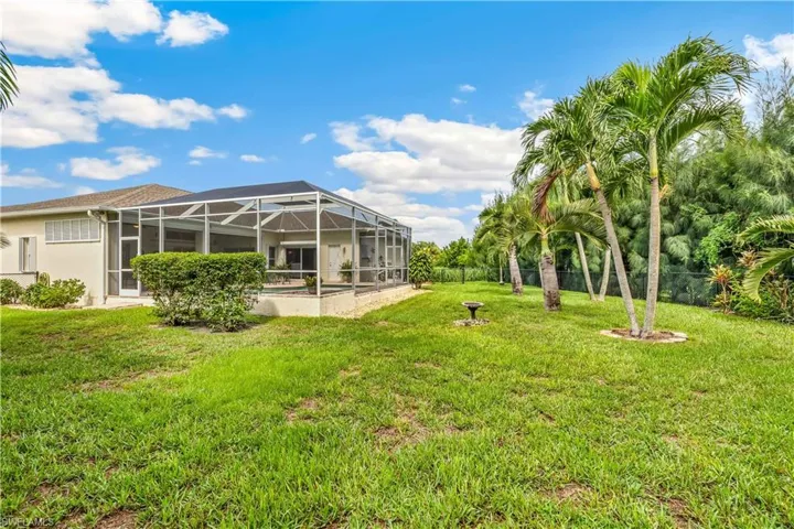 View of yard with a lanai