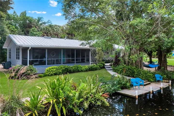 Adorned by lush landscaping...