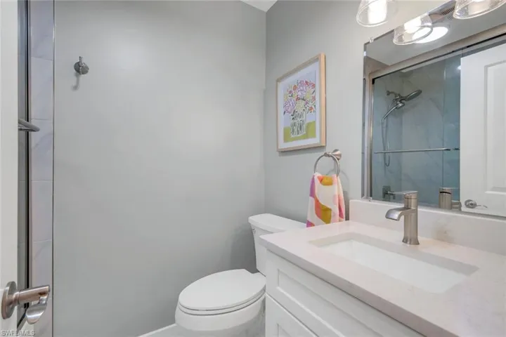 Guest bathroom features a shower and tub combination.