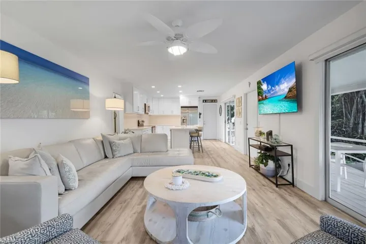 Living room and kitchen are open to one another.