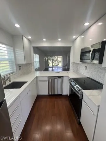 Kitchen view to Dining- Living- and Sunroom
