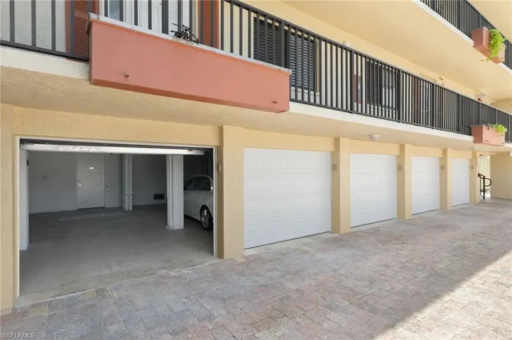 View of building exterior with an attached garage