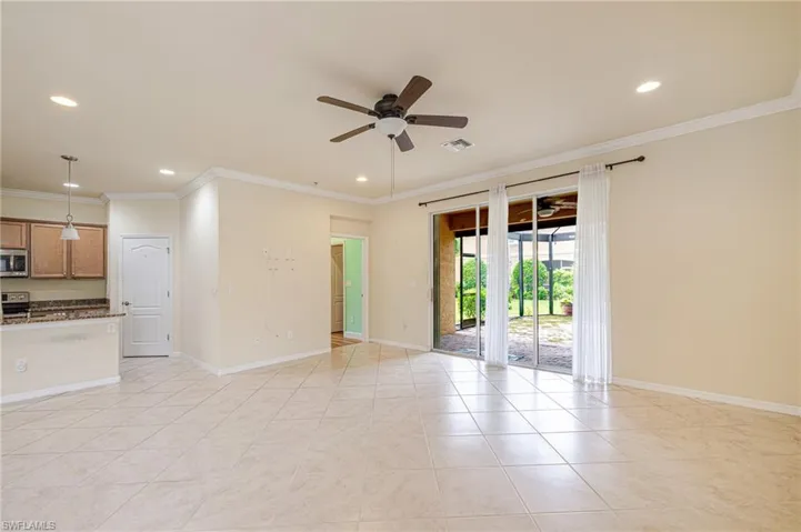 Tiled flooring throughout, recessed lighting, and crown molding