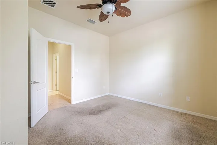 Neutral tone wall paint with a textured carpet floor