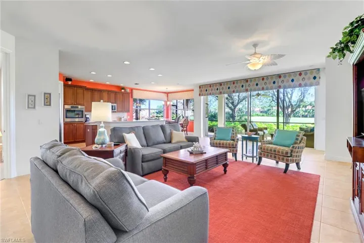 Living area. Open floor plan with an abundance of natural light and views of the golf course.