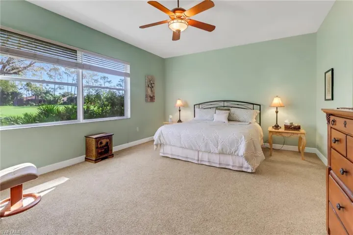 Primary suite with views of the golf course.