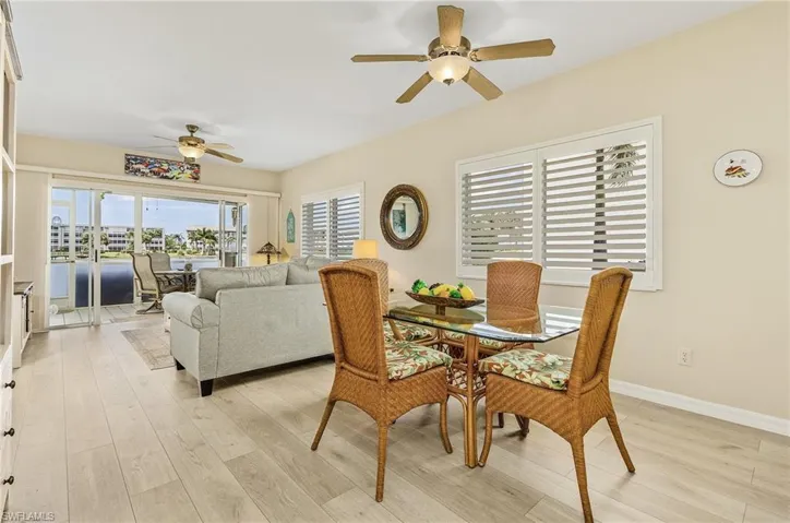 Dining and living areas have hurricane windows and plantation shutters.
