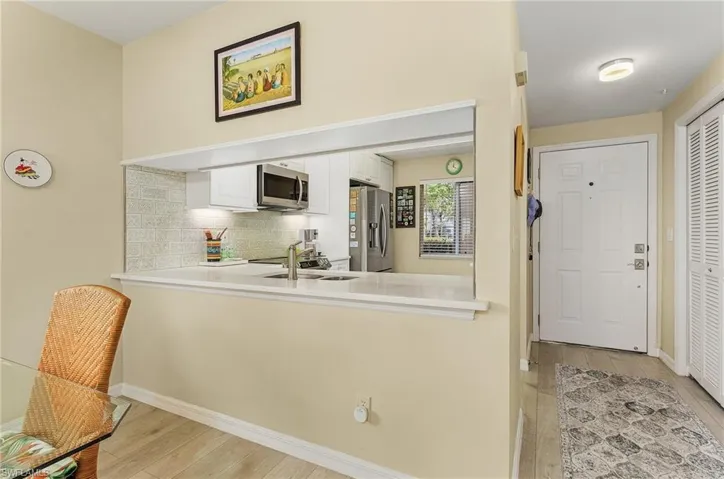 Looking through the pass through into the kitchen from the dining area.