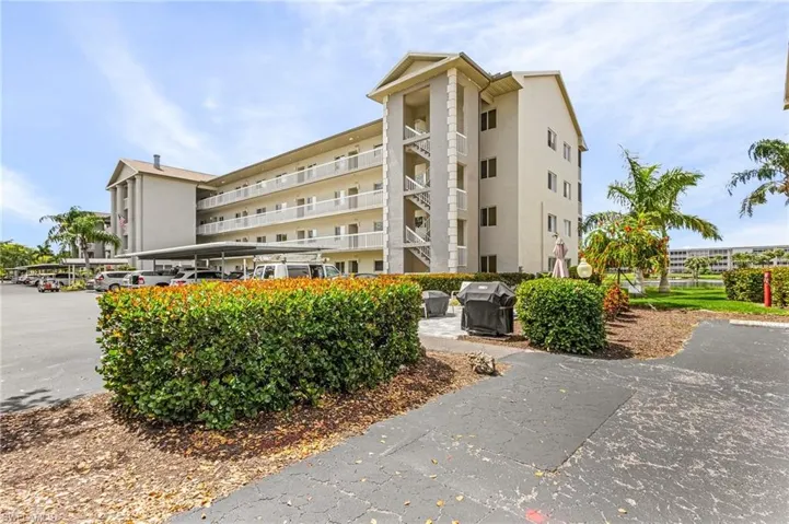 Property is the 1st floor unit. The social area with fire pit, pavers, and grills is right outside with a lovely view of the course and sunsets.