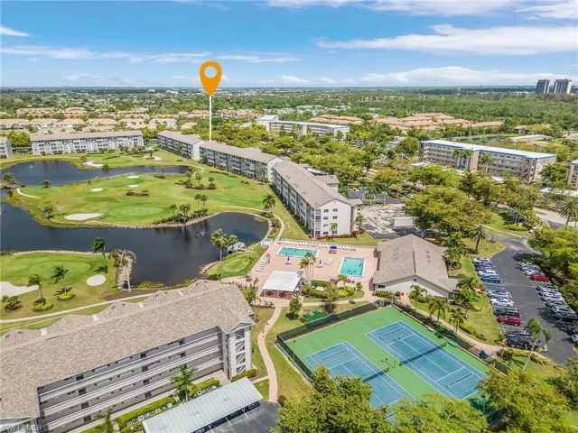 Birds eye view of Muirfield @ Golfview. It's the 2nd building as marked from the clubhouse, 2 of the 3 on-site pools, and tennis & pickle ball courts.