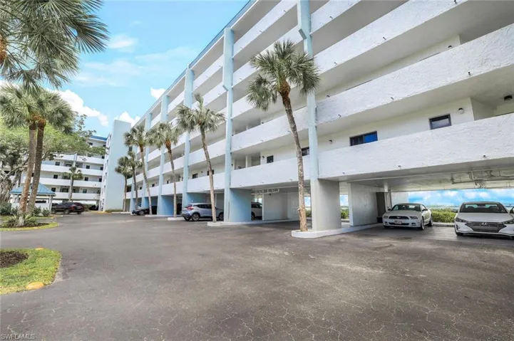 View of building exterior with a carport