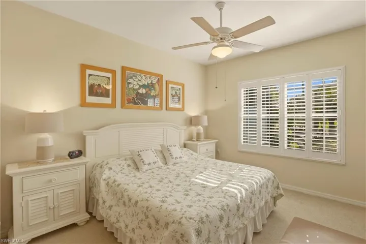 Main Bedroom featuring ceiling fan and light carpet