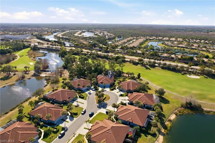 View of property location featuring a large body of water,  and a golf course