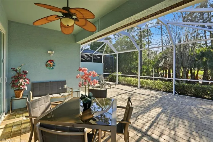View of patio featuring screen enclosure, paved patio and underroof lanai area