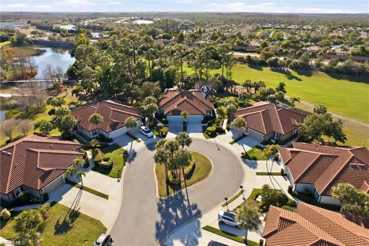 Aerial view of residential area featuring a local golf course