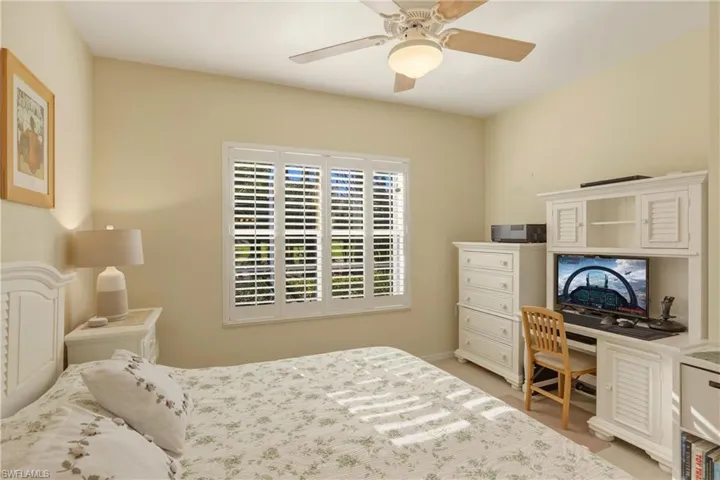 Main Bedroom featuring ceiling fan and plantation shutters