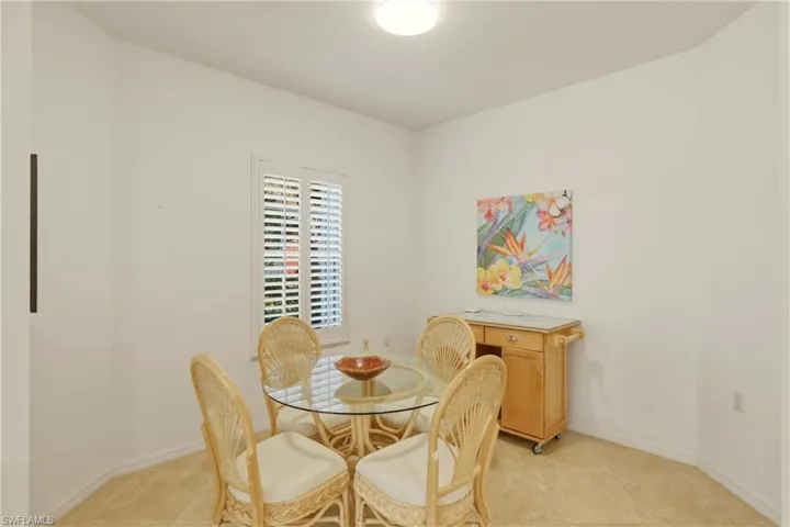 Tiled dining area with plantation shutters