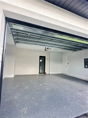 Garage featuring electric panel
