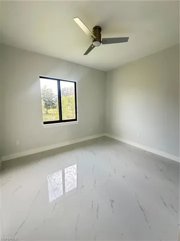 Spare room featuring ceiling fan