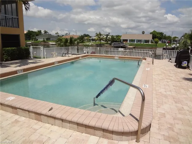 View of HEATED pool and deck & BBQ