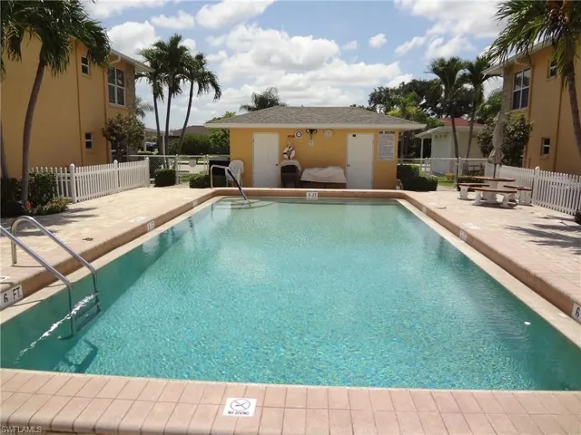 View of swimming pool featuring a deck