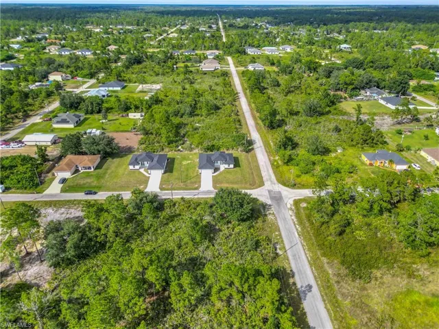 Aerial overview of property's location with nearby suburban area