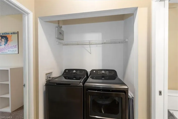Laundry area with new  washer and dryer