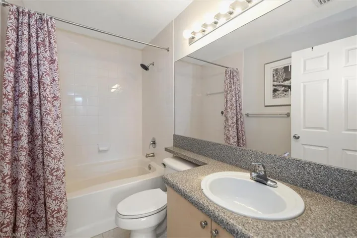 Primary bathroom with vanity and shower / tub combo