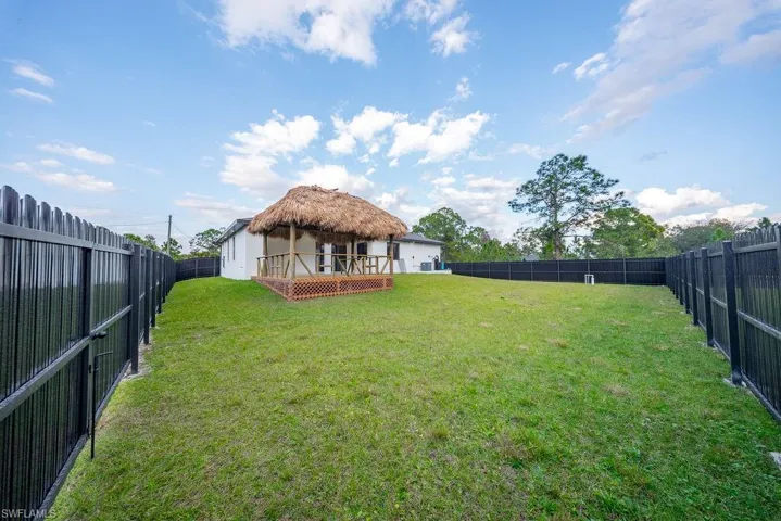 Fenced backyard with a wooden deck