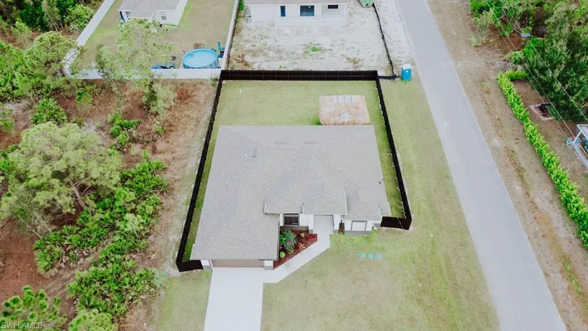 View from above of property featuring a pool area