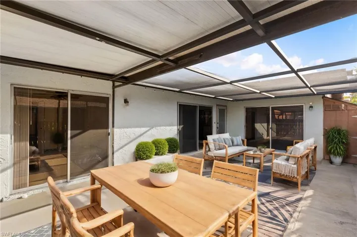 Sunroom / solarium with beam ceiling and coffered ceiling