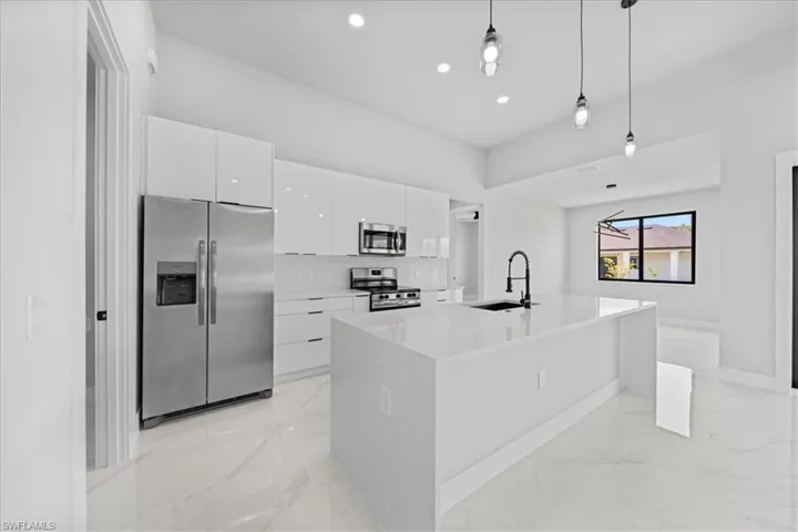 Acrylic Kitchen Cabinets & Quartz waterfall & countertops