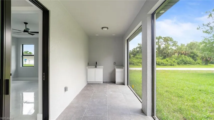 Unfurnished sunroom featuring a sink