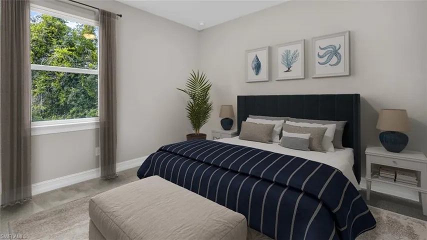 This image is virtually staged. Bedroom with baseboards and carpet flooring