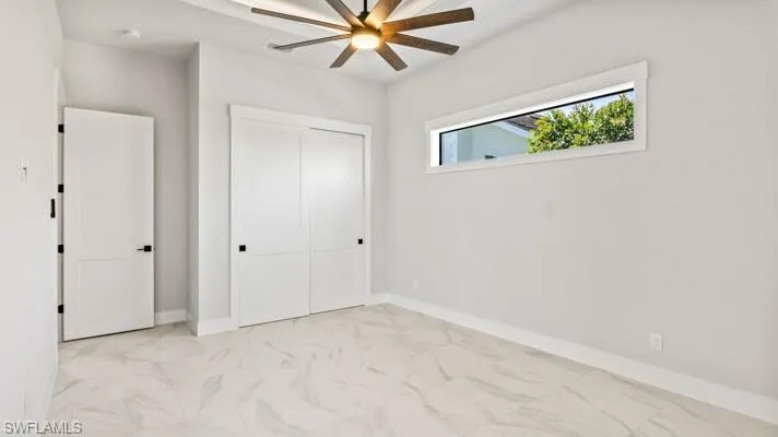 Guest bedroom 1 main floor with pool bath and slider to lanai