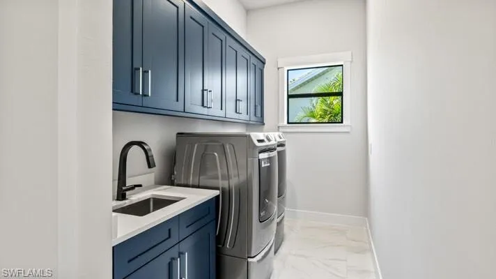 Large laundry room with cabinets,closet and built in laundry sink.