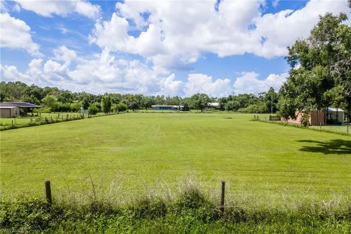 View of yard with a rural view