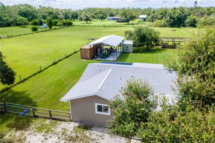Birds eye view of property with a rural view